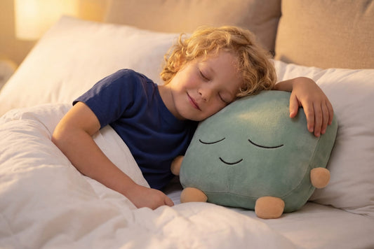 One Quiet Mind weighted plush tucked beside a child during a peaceful bedtime moment.