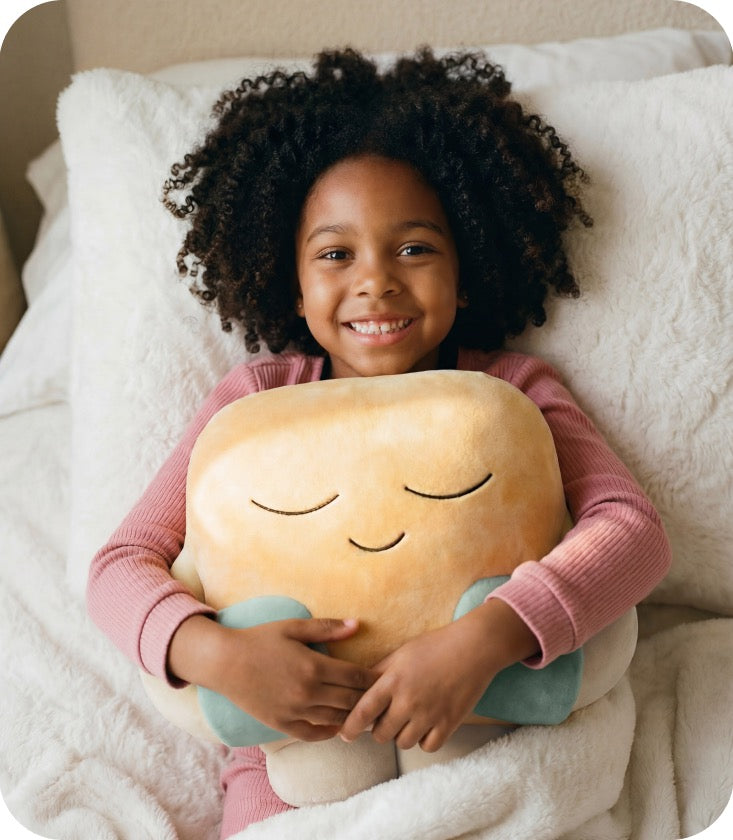 Child holding Hugsy